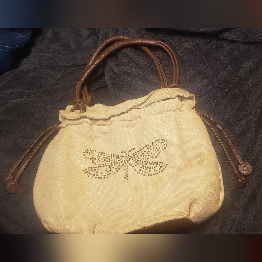 Nica tan color studded dragonfly linen blend tote bag.